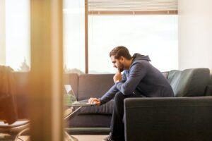 Man on laptop - Couch Flipping tips